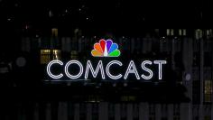 FILE PHOTO: The NBC and Comcast logo are displayed on top of 30 Rockefeller Plaza, formerly known as the GE building, in midtown Manhattan in New York July 1, 2015. REUTERS/Brendan McDermid