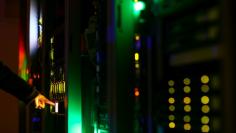 A man poses inside a server room at an IT company in this June 19, 2017 illustration photo. REUTERS/Athit Perawongmetha/Illustration