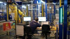 FILE PHOTO: An employee works in the aerospace equipment maker Daher plant in Saint-Aignan-Grandlieu near Nantes