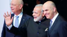 India's Prime Minister Narendra Modi, Klaus Schwab, Founder and Executive Chairman of World Economic Forum, and Swiss President Alain Berset attend the Opening Plenary during the World Economic Forum (WEF) annual meeting in Davos