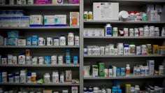 FILE PHOTO: Bottles of medications line the shelves at a pharmacy in Portsmouth