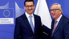 EU Commission President Juncker poses with Poland's PM Morawiecki in Brussels