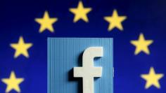 Picture illustration of 3D-printed Facebook logo in front of EU logo