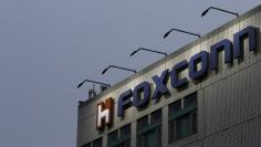 The logo of Foxconn, the trading name of Hon Hai Precision Industry, is seen on top of the company's headquarters in New Taipei City, Taiwan March 29, 2016. REUTERS/Tyrone Siu/File Photo 