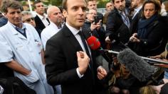 Emmanuel Macron, head of the political movement En Marche !, or Onwards !, and candidate for the 2017 French presidential election, speaks to journalists during a visit to the Hospital Raymond-Poincare in Garches