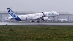 An Airbus A321LR takes off during a presentation of the company's new long range aircraft in Hamburg-Finkenwerder