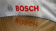 The Bosch logo is reflected in a semiconductor wafer in the company manufacturing base in Reutlingen, Germany, June 16, 2017.  REUTERS/Michaela Rehle