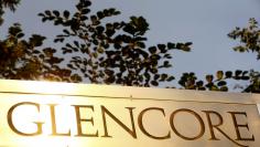 FILE PHOTO: The logo of commodities trader Glencore is pictured in front of the company's headquarters in Baar, Switzerland, July 18, 2017.  REUTERS/Arnd Wiegmann/File Photo