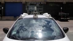 A self-driving car being developed by nuTonomy, a company creating software for autonomous vehicles, is parked near their offices in Boston, Massachusetts, U.S., June 2, 2017.   REUTERS/Brian Snyder