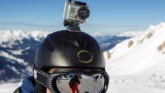 A skier wears a GoPro camera on his helmet as he rides down the slopes in the ski resort of Meribel