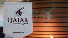FILE PHOTO: A logo of Qatar Airways is seen at Hamad International Airport in Doha, Qatar June 12, 2017. REUTERS/Naseem Zeitoon 