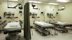 Beds lie empty in emergency room of Tulane University Hospital in New Orleans