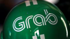 FILE PHOTO: A Grab motorbike helmet is displayed during Grab's fifth anniversary news conference in Singapore
