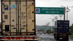 Trucks carrying containers enter the Jawaharlal Nehru Port Trust (JNPT) on the outskirts of Mumbai, June 28, 2017. REUTERS/Shailesh Andrade/Files