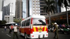 An ambulance arrives at the Indonesian Stock Exchange building following reports of a collapsed structure inside the building in Jakarta