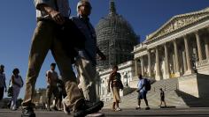 Tourists walk past the U.S. Capitol in Washington September 8, 2015. REUTERS/Jonathan Ernst 