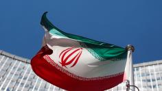 An Iranian flag flutters in front of the UN headquarters in Vienna