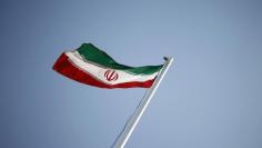 An Iranian national flag flutters in Tehran April 15, 2011.  REUTERS/Morteza Nikoubazl