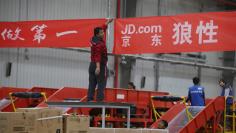 FILE PHOTO: An employee works at a JD.com logistics centre in Langfang, Hebei province, November 10, 2015. REUTERS/Jason Lee/File Photo