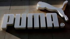 FILE PHOTO: The logo of German sports goods firm Puma is seen at the entrance of one of its stores in Vienna