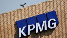 FILE PHOTO: The KPMG logo is seen at the company's head offices in Parktown, Johannesburg, South Africa, September 15, 2017. REUTERS/Siphiwe Sibeko/File Photo
