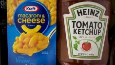 A box of Kraft macaroni and cheese and a Heinz Ketchup bottle are displayed together on a grocery store shelf in New York March 25, 2015.  REUTERS/Brendan McDermid 
