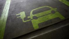 FILE PHOTO:  A sign is painted on a parking space for electric cars inside a car park in Hong Kong