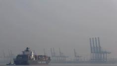 FILE PHOTO: The Panama-registered cargo ship "YM Los Angeles" approaches the terminal at Port Klang, near Kuala Lumpur February 27, 2015. REUTERS/Olivia Harris/File Photo       