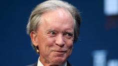 FILE PHOTO: Janus Capital Group's Bill Gross listens during the Milken Institute Global Conference in Beverly Hills