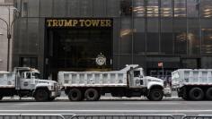 FILE PHOTO: A line of sanitation trucks filled with sand line Fifth Ave. in front of Trump Tower amid heightened security before the start of the United Nations General Assembly in New York City, U.S., September 17, 2017. REUTERS/Stephanie Keith 