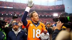 Jan 24, 2016 File photo; Denver, CO, USA; Denver Broncos quarterback Peyton Manning (18) waves to the crowd after the AFC Championship football game against the New England Patriots at Sports Authority Field at Mile High. Mandatory Credit: Mark J. Rebilas