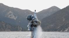 North Korean leader Kim Jong Un guides on the spot the underwater test-fire of strategic submarine ballistic missile in this undated photo released by North Korea's Korean Central News Agency (KCNA) in Pyongyang on April 24, 2016. KCNA/via REUTERS. 