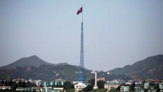 FILE PHOTO: A North Korean flag flutters on top of a tower at the propaganda village of Gijungdong in North Korea, in this picture taken near the truce village of Panmunjom, South Korea, August 26, 2017.  REUTERS/Kim Hong-Ji  