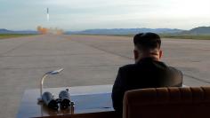 FILE PHOTO: North Korean leader Kim Jong Un watches the launch of a Hwasong-12 missile in this undated photo released by North Korea's Korean Central News Agency (KCNA) on September 16, 2017. KCNA via REUTERS  