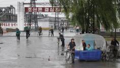 Workers leave the February 8 Vinalon Complex in Hungnam