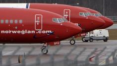 FILE PHOTO: Parked Boeing 737-800 aircrafts belonging to budget carrier Norwegian Air are pictured at Stockholm Arlanda Airport, Sweden, in this March 6, 2015 file photo. REUTERS/Johan Nilsson/TT News Agency/File Photo 