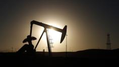 A pump jack is seen at sunrise near Bakersfield, California October 14, 2014.  REUTERS/Lucy Nicholson