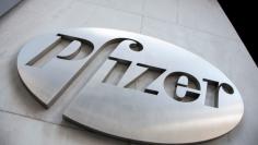 FILE PHOTO: The Pfizer logo is seen at their world headquarters in New York April 28, 2014.  REUTERS/Andrew Kelly/File Photo     