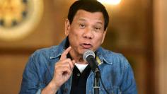 FILE PHOTO: Philippine President Rodrigo Duterte announces the disbandment of police operations against illegal drugs at the Malacanang palace in Manila, Philippines early January 30, 2017.    REUTERS/Ezra Acayan/File Photo