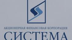 The logo of Russian conglomerate Sistema is seen on a board at the St. Petersburg International Economic Forum 2017 (SPIEF 2017) in St. Petersburg, Russia, June 1, 2017. Picture taken June 1, 2017. REUTERS/Sergei Karpukhin