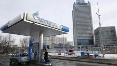 A view shows a petrol station of Gazprom Neft company and the headquarters of the Russian natural gas producer Gazprom in Moscow, February 24, 2015.  2015. REUTERS/Maxim Zmeyev 
