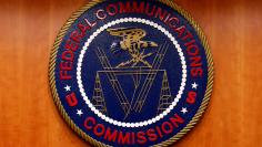 FILE PHOTO: The Federal Communications Commission (FCC) logo is seen before the FCC Net Neutrality hearing in Washington