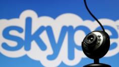 FILE PHOTO: A web camera is seen in front of a Skype logo in this photo illustration May 26, 2015. REUTERS/Dado Ruvic/File Photo