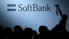 FILE PHOTO: The logo of SoftBank Group Corp is displayed at SoftBank World 2017 conference in Tokyo, Japan, July 20, 2017. REUTERS/Issei Kato/File Photo