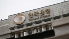 FILE PHOTO -  The logo of the Bank of Korea is seen on the top of its building in Seoul, South Korea, March 8, 2016.  REUTERS/Kim Hong-Ji/File Photo   