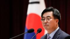 FILE PHOTO: South Korean Finance Minister Kim Dong-yeon speaks during his inaugural ceremony in Sejong government complex in Sejong, South Korea, June 15, 2017.  REUTERS/Kim Hong-Ji 