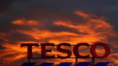 FILE PHOTO: A company logo is pictured outside a Tesco  supermarket in Altrincham northern England, April 16, 2016. REUTERS/Phil Noble/File Photo