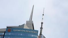 The Thomson Reuters logo is seen on the company building in Times Square, New York, U.S., January 30, 2018. REUTERS/Andrew Kelly