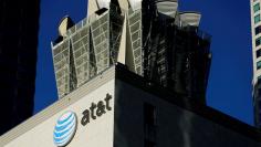 FILE PHOTO:    An AT&T logo and communication equipment is shown on a building in downtown Los Angeles, California October 29, 2014.    REUTERS/Mike Blake/File Photo