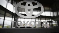 A Toyota logo is seen in a showroom at a Toyota dealership in Warsaw April 11, 2014.  REUTERS/Kacper Pempel 